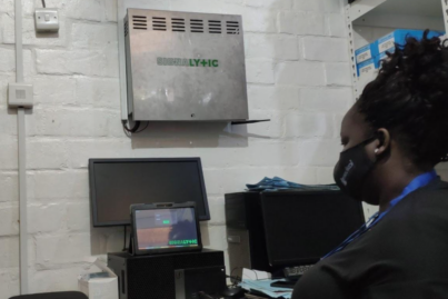 woman looking at terminal tablet using the signalytic hardware-software system